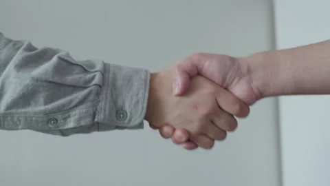 A long handshake between two men Stock Footage 260223803