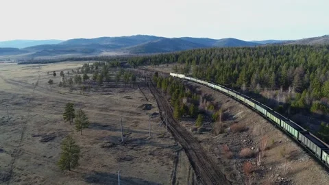 Long havy cargo train with coal in wagons. Motion filmed from copter Stock Footage 203919634