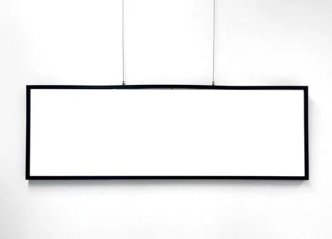 Long horizontal frame hangs on wall with empty blank space. Minimal mock up Stock Photos