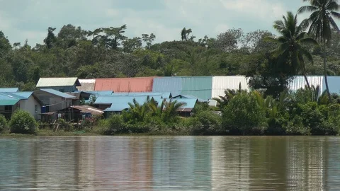Long house by the river of Borneo Stock Footage 106168969