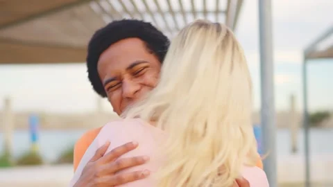 Long hug between multi-ethnic reunited friends in the city Stock Footage 265023145