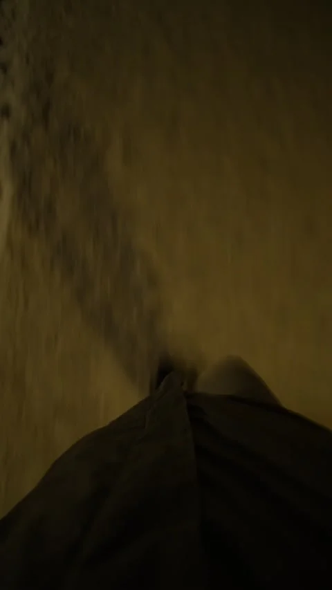Long human shadow walking on yellow asphalt at dark moody night. Stock Footage 331216569