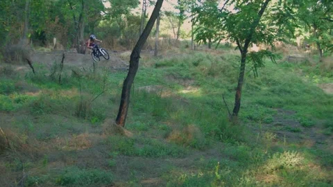 Long jump on springboard of biker Stock Footage 100533051