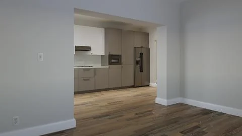 Long kitchen with a large refrigerator and a window over the sink. 3d render Illustrazione stock