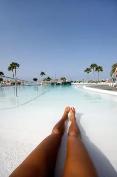 Long legs in pool Stock Photos