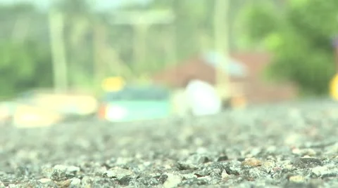 LONG LENS: RACK FOCUS TO MAN AT CAR IN GHANA Stock Footage 58930414