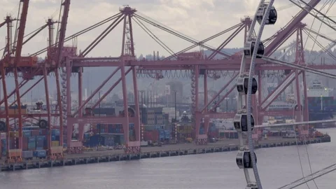Long lens shot of seattle ferris wheel with port in background Stock Footage 83320040