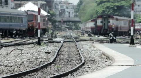 Long-lens shot with shallow depth of field of trains moving slowly in the swi Stock Footage 52604179