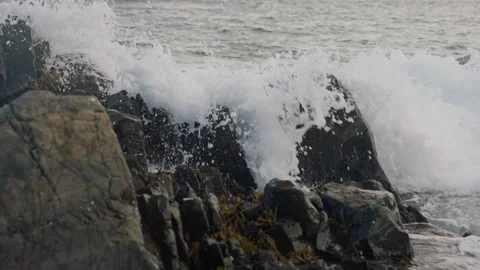 Long Lens Slow Motion of Big Sea Waves Splashing on Rocks on the Coast, 4K Stock Footage 258397191