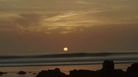Long lens timelapse of sunset over ocean in Casamance, Senegal — dramatic clouds Stock Footage 309913465