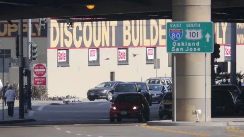 Long lens traffic san francisco with sign for oakland san jose highway Stock Footage 83529201
