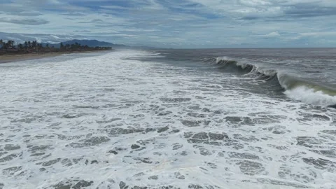 Long line of breaking storm waves on the Pacific near Acapulco, drone aerial Stock Footage 348254646