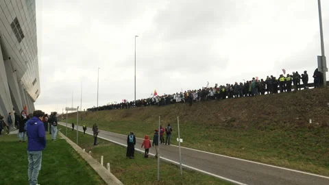 Long line of climate activists about to block the highway. Amsterdam, Netherland Stock Footage 266546281