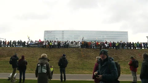 Long line of climate activists about to trespass onto highway. Amsterdam. Stock Footage 266546559