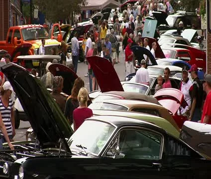 Long line of Mustangs with spectators Stock Footage 21644031