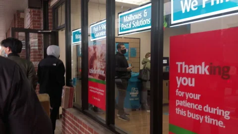 Long Line Outside UPS Store. Sign Thanks Customers for Patience Stock Footage 169331667