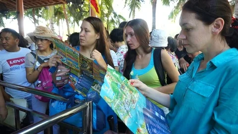 A long line of tourists. Excursion on the coast. Stock Footage 70688108