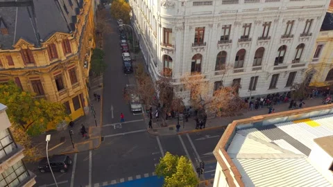 Long line of tourists standing outside of Eguiguren Palace, santiago, chile Stock Footage 313348256