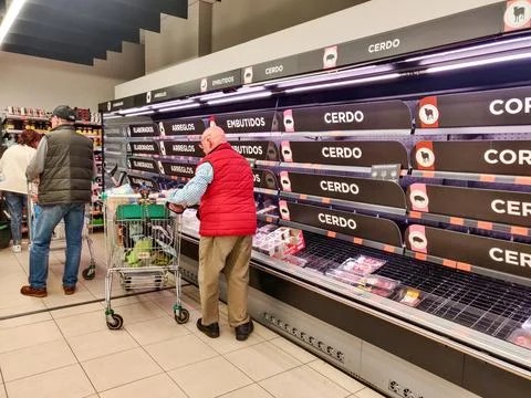 Long lines, empty shelves at supermarkets as coronavirus panic grips Spain, Madr Stock Photos