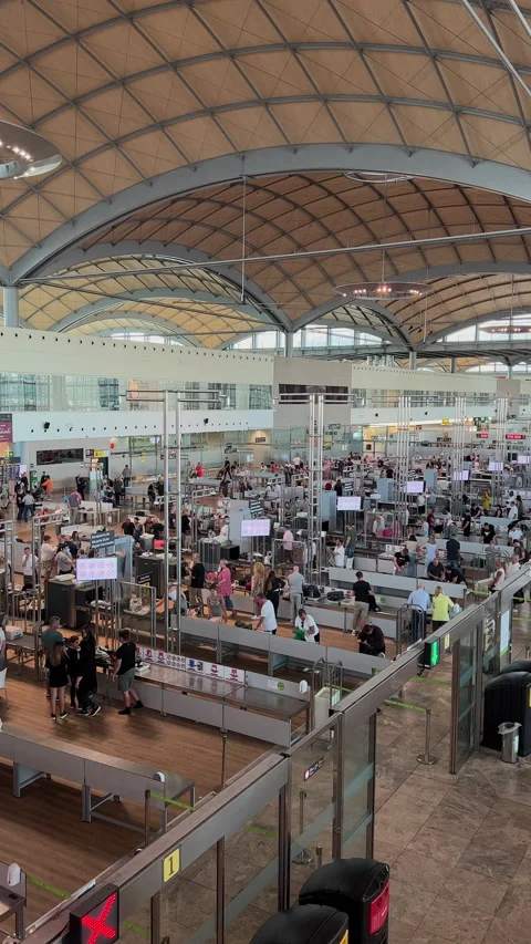 Long Lines of people wait to go through Alicante airport security check point. Stock Footage 220413580