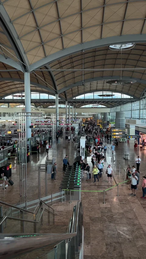 Long Lines of people wait to go through Alicante airport security check point. Stock Footage 220413830