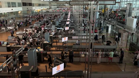 Long Lines of people wait to go through Alicante airport security check point. Stock Footage 220414451