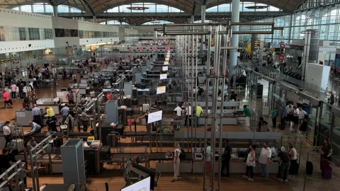 Long Lines of people wait to go through Alicante airport security check point. Stock Footage 220415006