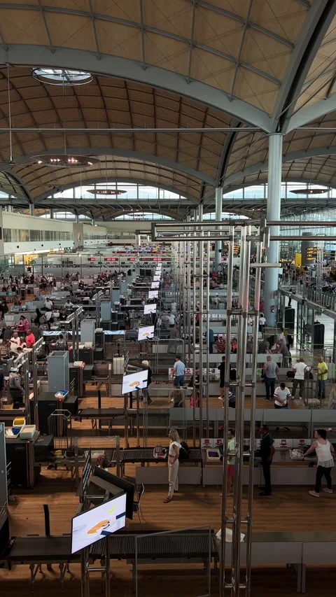 Long Lines of people wait to go through Alicante airport security check point. Stock Footage 220415020