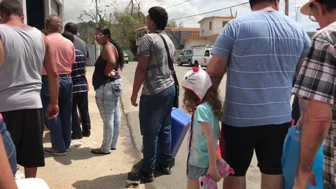 Long lines to receive aid at an distribution point during relief crisis Stock Footage 82244511