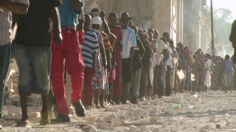 Long lines of refugees wait on the stree... | Stock Video | Pond5