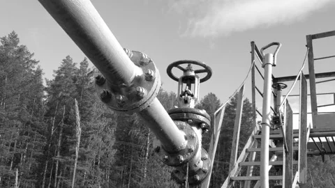 The long metal pipe of the pipeline. Gate valve. Stock Footage 131663899