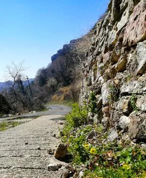 A long, mountain road. Stock Photos