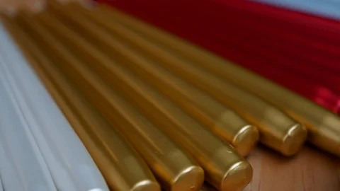 Long multicolor taper candles on light wooden surface, close-up  Video stock 89240208
