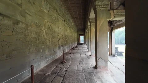 Long, narrow ancient corridor at Angkor Wat Video stock 276426809