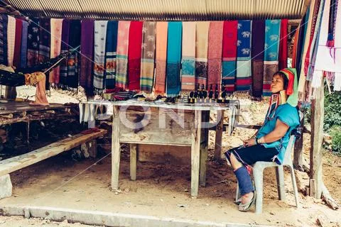 Long Neck Woman wearing at traditional costume. Tribal village Thailand. Stock Photos