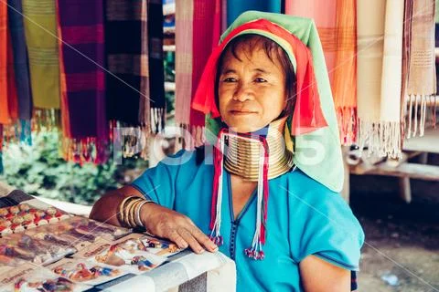 Long Neck Woman wearing at traditional costume. Tribal village Thailand. Stock Photos