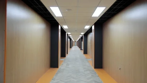 A long office corridor without people. A person's view of moving down a corridor Stock Footage 217356841
