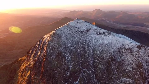 Long panning aerial orbit of Mount Snowdon at sunrise. Stock-Footage 71242445