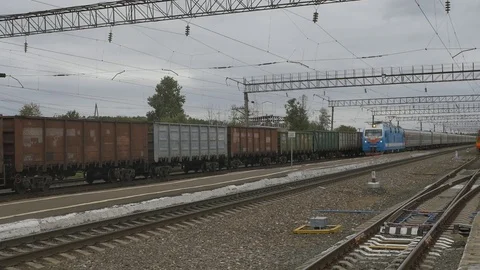 A long passenger train is passing by. Stock Footage 114497566