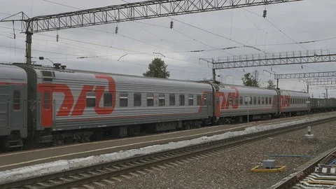 A long passenger train is passing by. Stock Footage 114497568