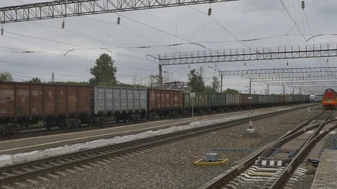 A long passenger train is passing by. Stock Footage 114497573