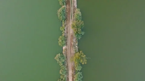 The long path in the middle of the green lake Stock Footage 54236131