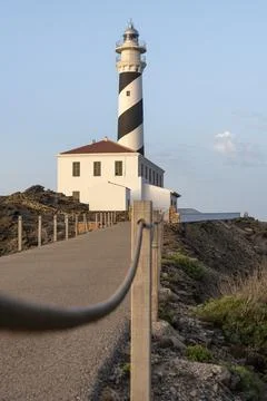 Long path until you reach the Favaritx lighthouse in Menorca in the Baleari.. Stock Photos