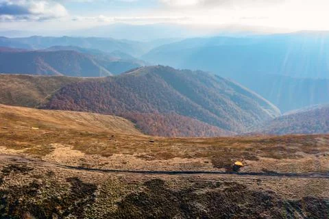 Long pathways running along mountains under blue sky Stock-Fotos