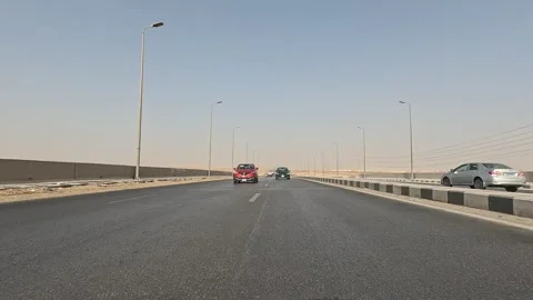 Long peaceful drive through Cairo Fayoum Desert Road endless desert highway Stock-Footage 329837977