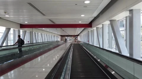 Long pedestrian bridge over Sheikh Zayed Road in Dubai connecting the metro s 스톡 동영상 312333609