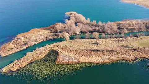 Long peninsula or island and a river in the middle - sediment deposition Stock Footage 165979953