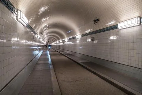 Long perspective inside the historic tunnel of the Old Elbe in Hamburg. Stock Photos