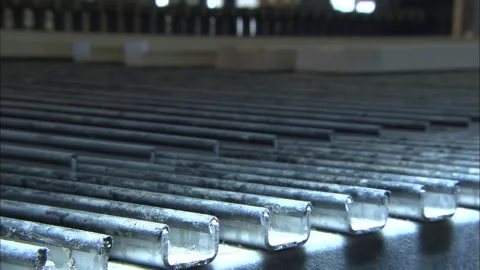 Long perspective of stacked lumber boards at industrial wood facility Stockbeeldmateriaal 329685756