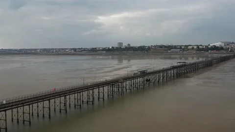 Long pier leading far from Thames river estuary coast Stock Footage 167912347